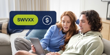 Couple looking at SWVXX on laptop screen