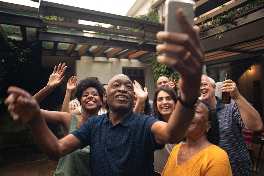 Grandfather taking a selfie with the family