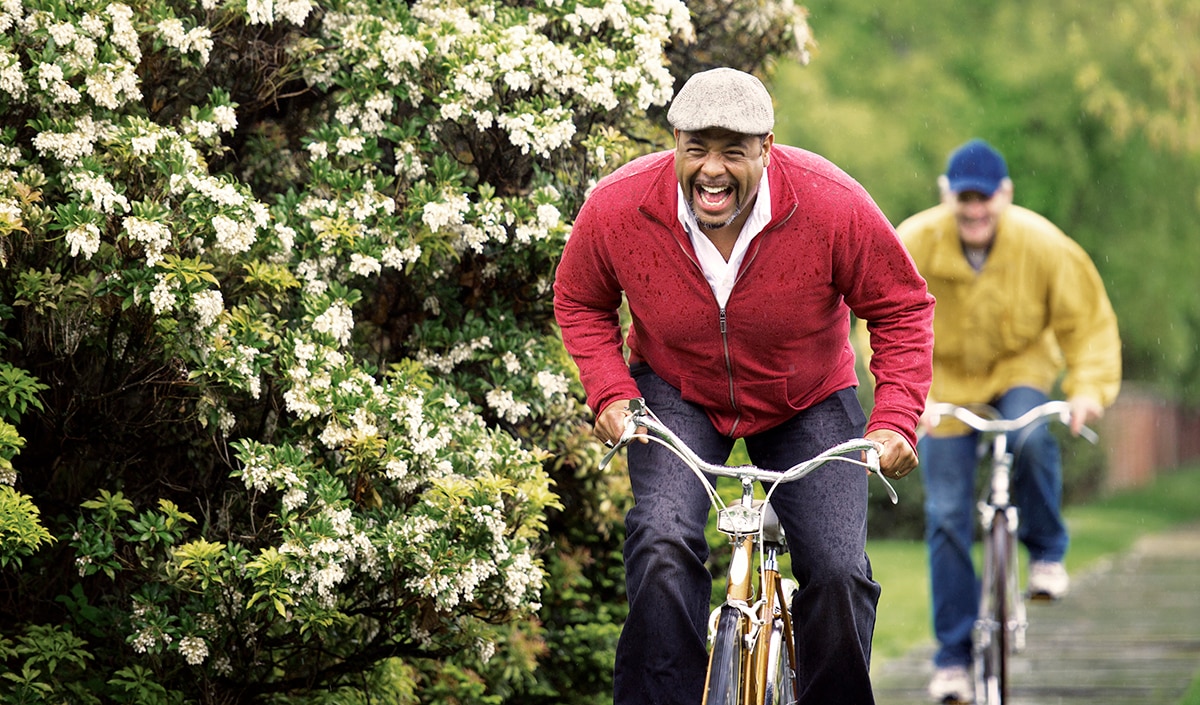 Two men riding bicycles