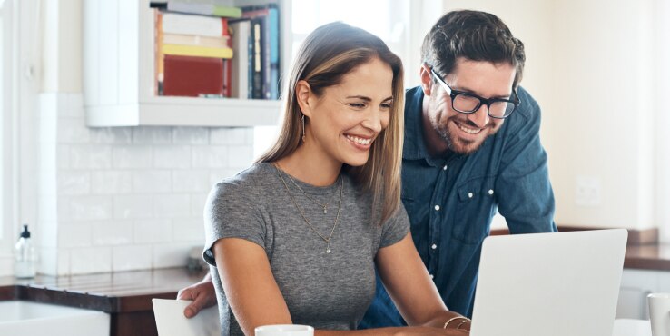 Couple looking at a laptop
