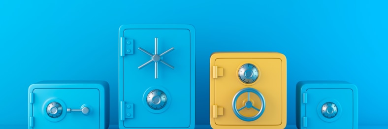 Photo of four combination safes, three blue and one yellow.