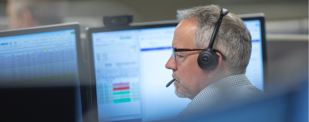 Trader support team member. with headset