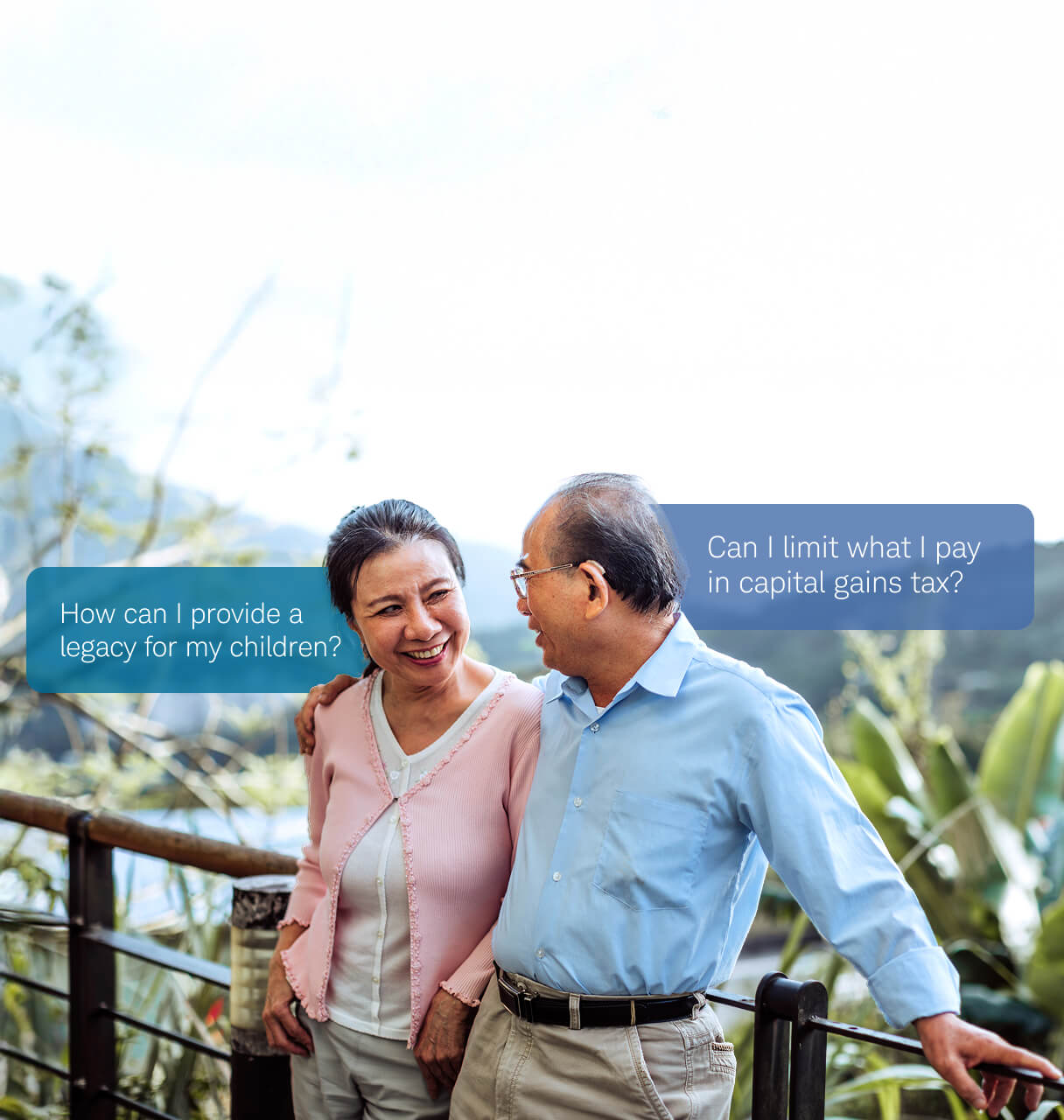 Older couple smiling while walking outdoors, with speech bubbles asking "How can I provide a legacy for my children?" and "Can I limit what I pay in capital gains tax?"